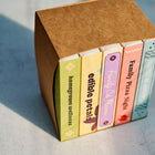 Curated seed collection boxes in a brown cardboard sleeve, featuring Homegrown Wellness and Family Pizza Night themes.