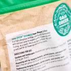 Close-up of a Gaia Green Power Bloom 2-8-4 fertilizer bag showing directions for use and a green circular logo.
