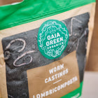 1.5 lb bag of Gaia Green Worm Castings featuring a green logo and dark soil texture on a tan background.