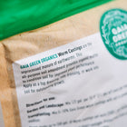 Close-up of a Gaia Green Worm Castings bag showing the product description and green logo on tan packaging.