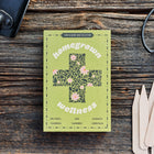 Green Homegrown Wellness medicinal herb seed kit box on a wooden surface with a trowel, shears, and plant markers.