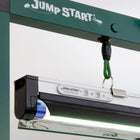 Jump Start 2' T5 grow light fixture suspended by a green cord from a dark green metal stand with an integrated timer.