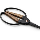 Small Walnut Garden Scissors with black metal blades and ergonomic walnut wood handles on a white background.