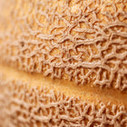 Close-up of the textured, tan netting on the rind of a Hale’s Best Jumbo cantaloupe melon.